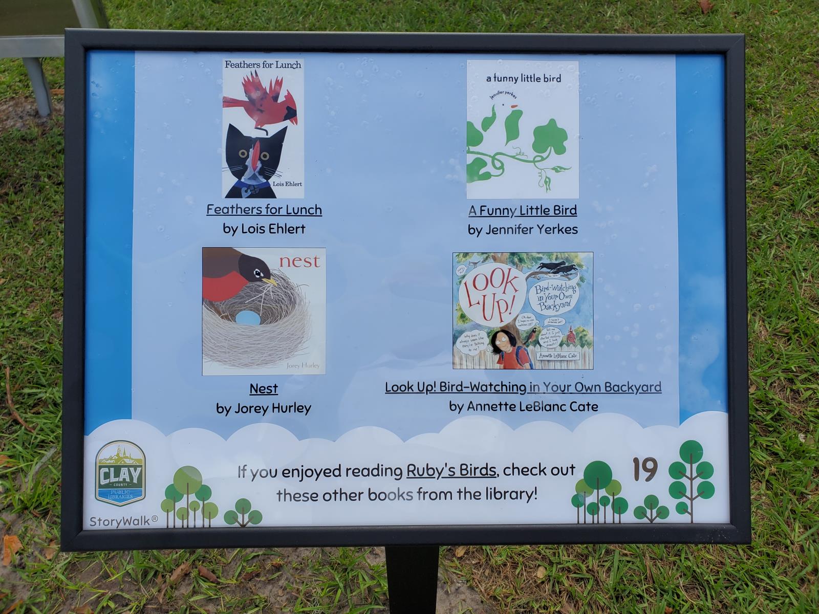 Close up picture of the StoryWalk page with similar books to Ruby's Birds