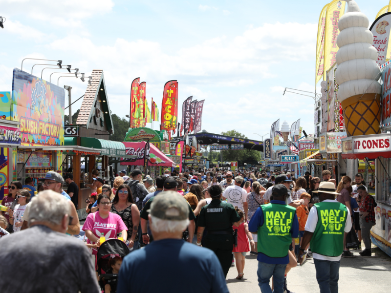 Vendors and crowd at fairground