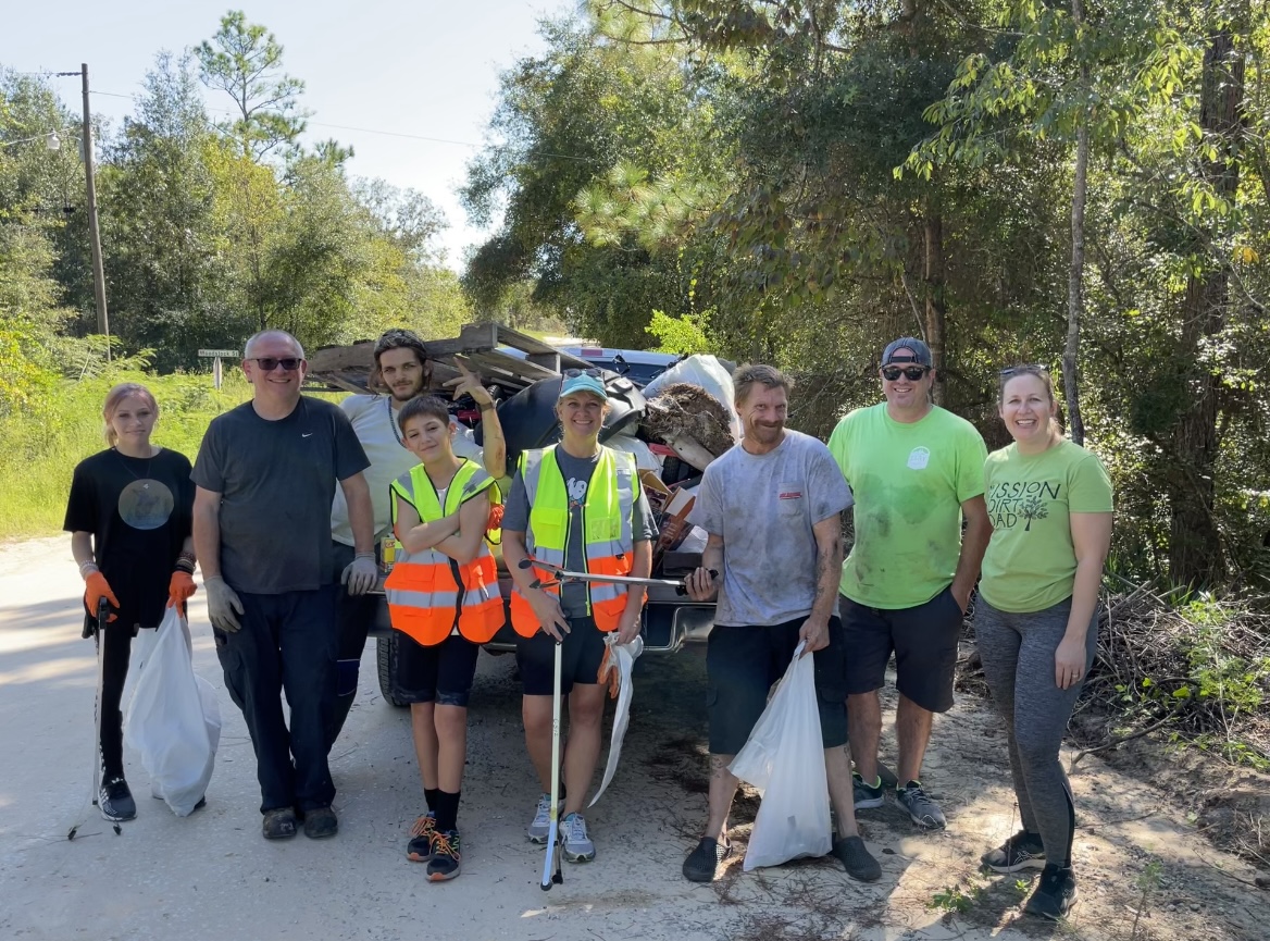 volunteers helping with roadside cleanup