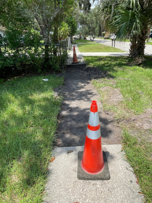 Sidewalk with orange arrows