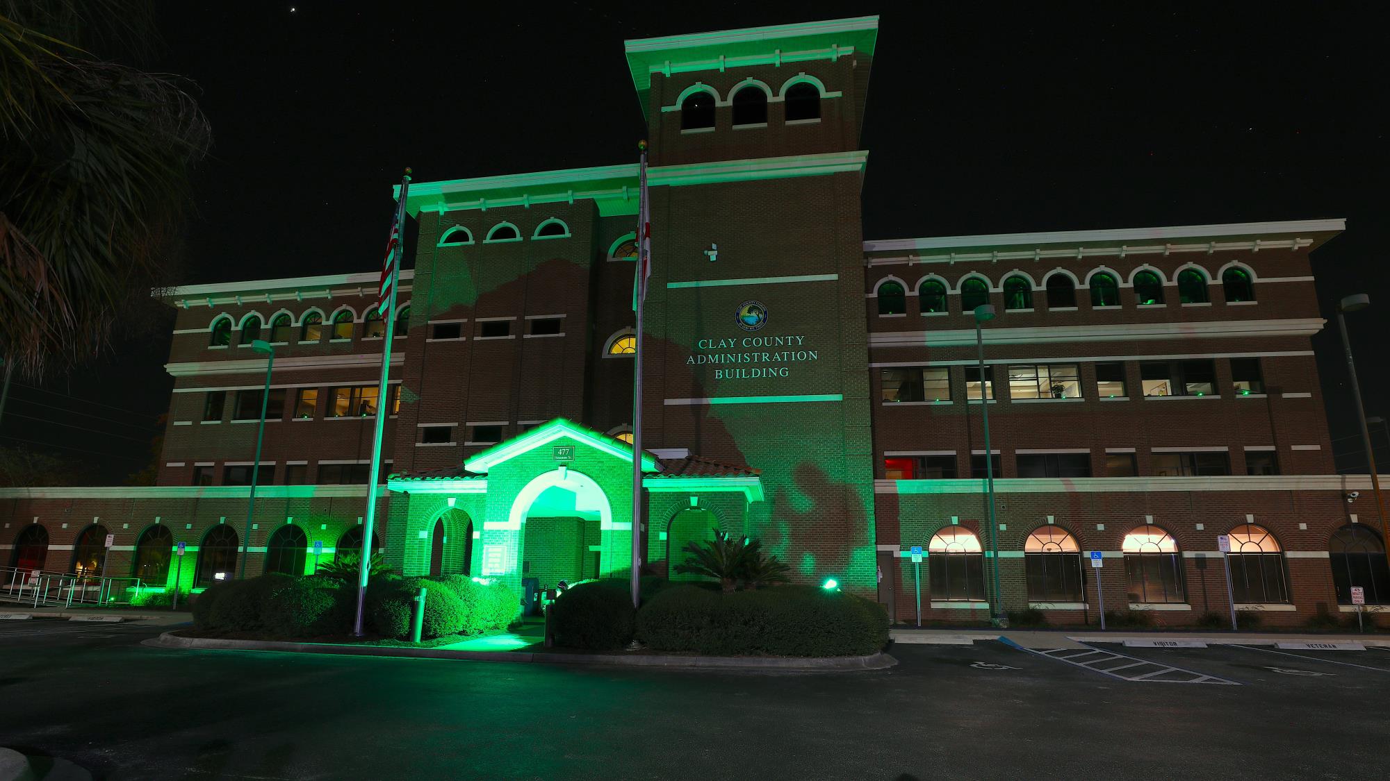 Building lit in green lighting