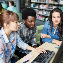 Teens on computer at library