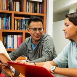 Adults reading at library