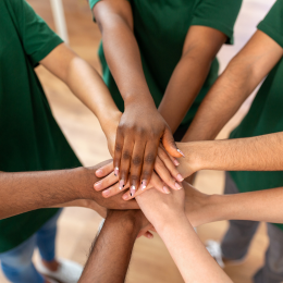 image of people with hands in the middle