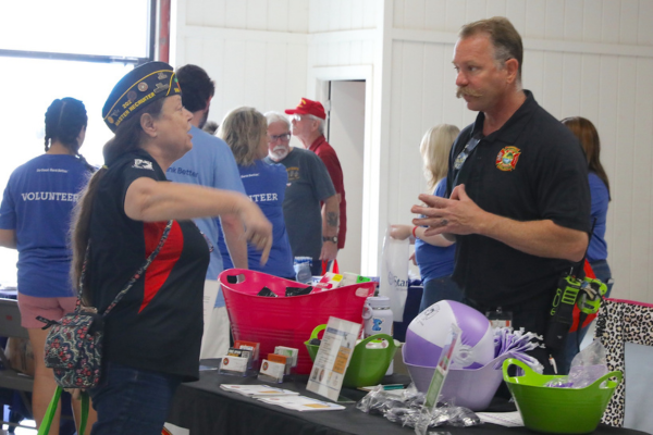 Women visiting the Paramedicine table